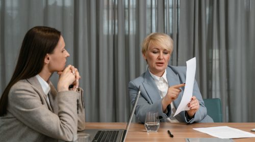Employee and manager reviewing HR contract